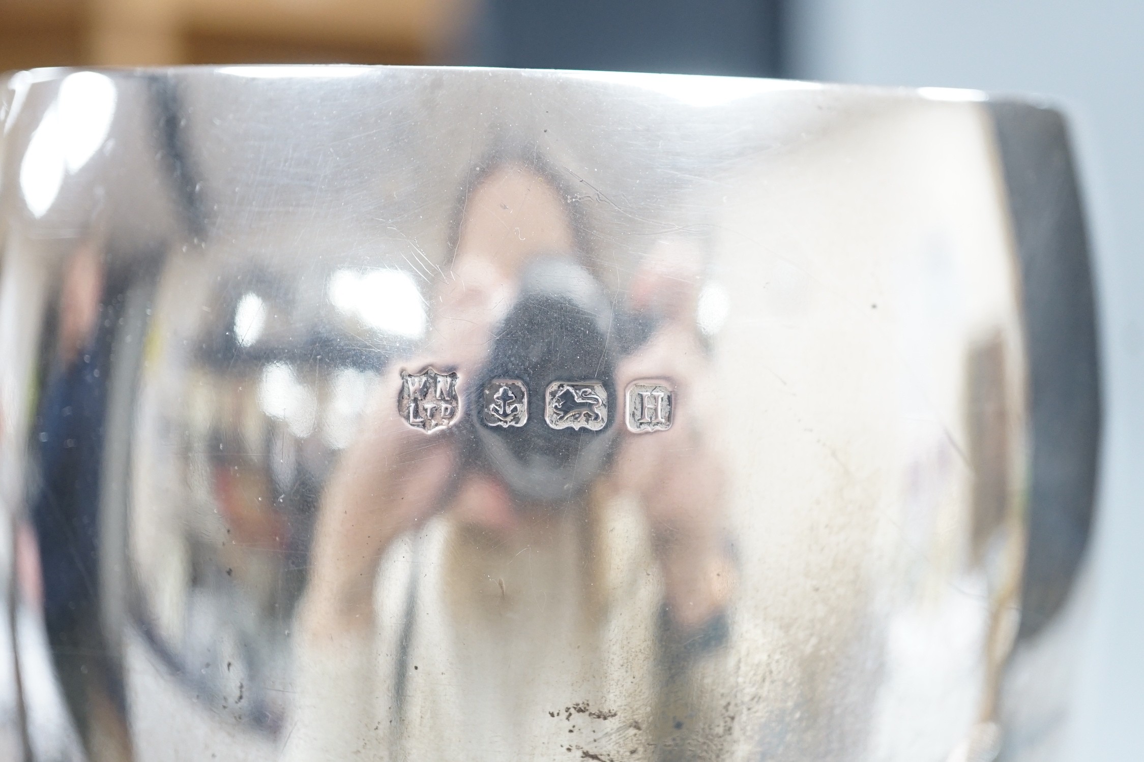 A silver trophy cup inscribed 'Winner Divine Lady', Birmingham 1932, 24.5cm, 10oz and a smaller two handled trophy cup 'Eastbourne Poetry Society Challenge Cup' (London 1914), 5oz